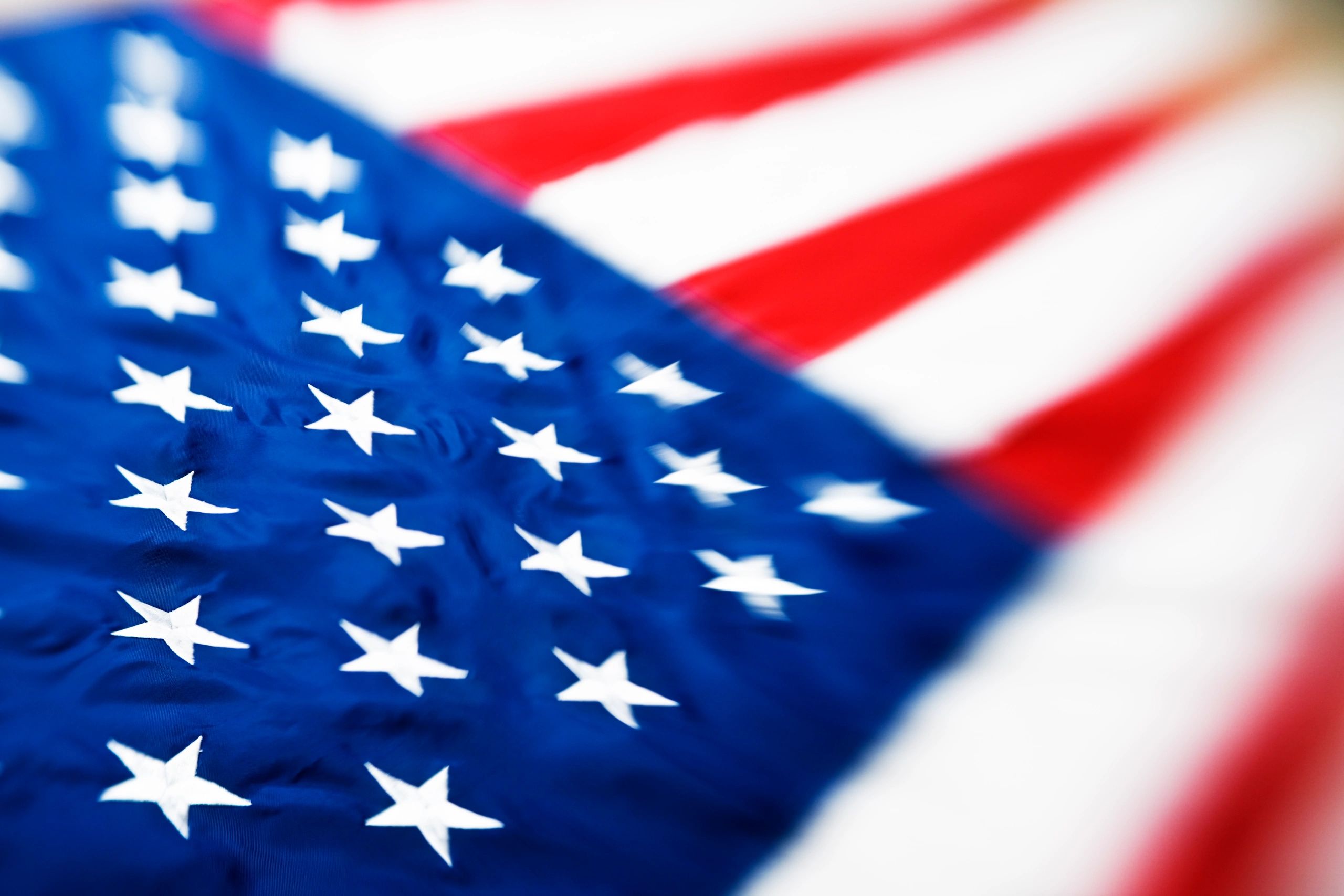 Soft American flag background with light patriotic tones
